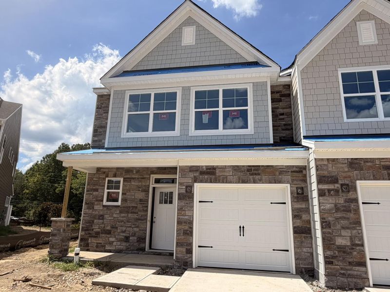 Front exterior of a new home in Harrisburg Village Townhomes, Harrisburg, NC, highlighting curb appeal (Image 1). Front exterior of a new home in Harrisburg Village Townhomes, Harrisburg, NC, highlighting curb appeal (Image 1).