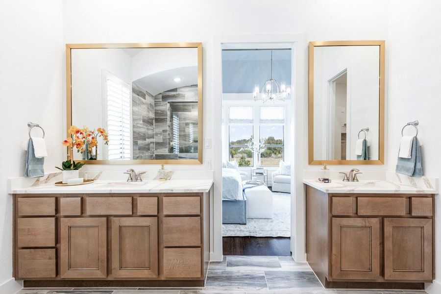 Bathroom with a sink, two vanities, ensuite bath, and a chandelier Bathroom with a sink, two vanities, ensuite bath, and a chandelier
