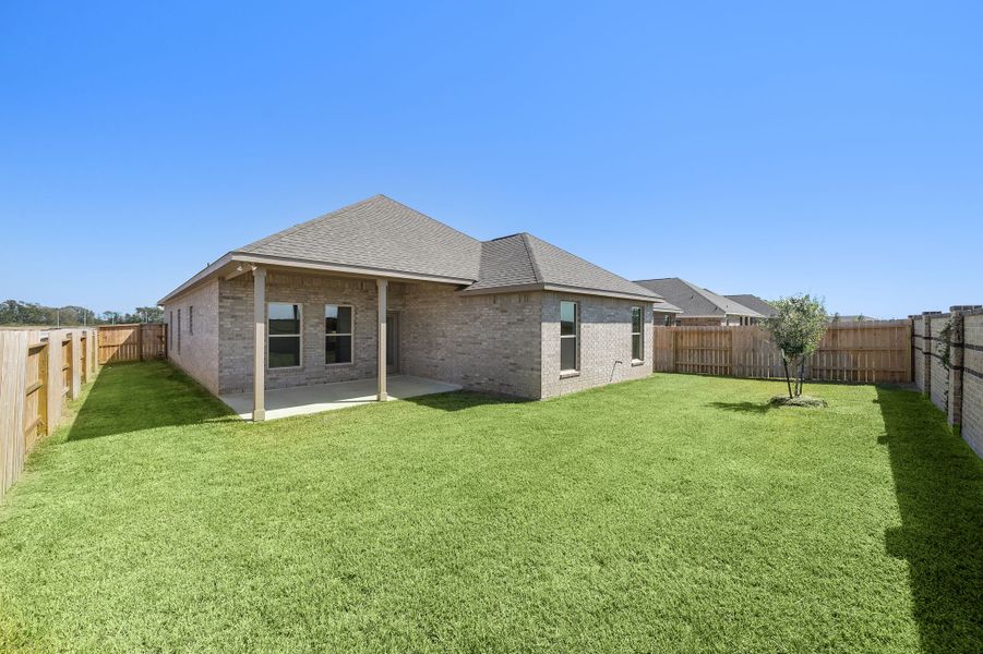 Front exterior of a new home in Emberly 55, Beasley, TX, highlighting curb appeal (Image 19). Front exterior of a new home in Emberly 55, Beasley, TX, highlighting curb appeal (Image 19).