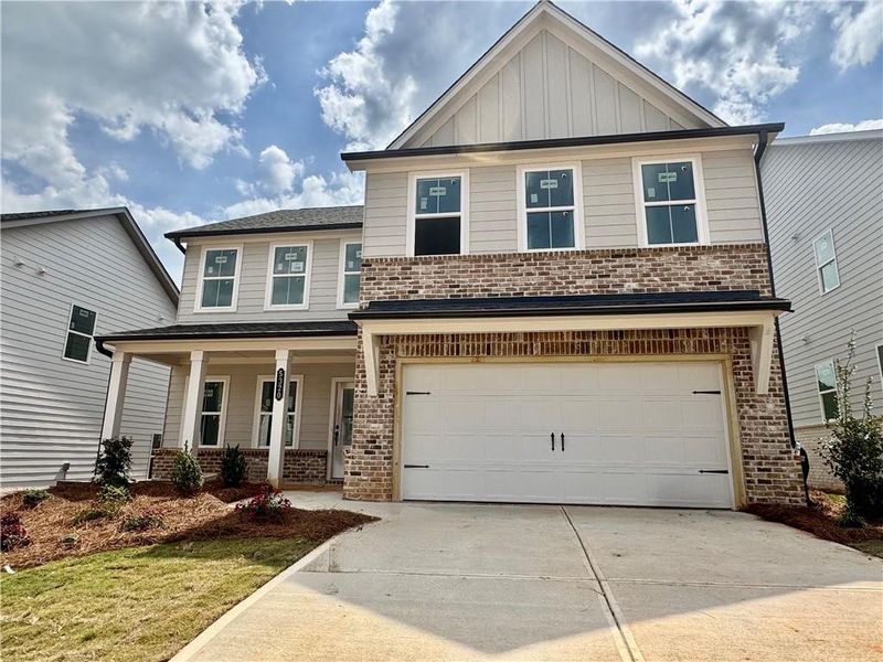 Front exterior of a new home in Eastlyn Crossing, Flowery Branch, GA, highlighting curb appeal (Image 9).