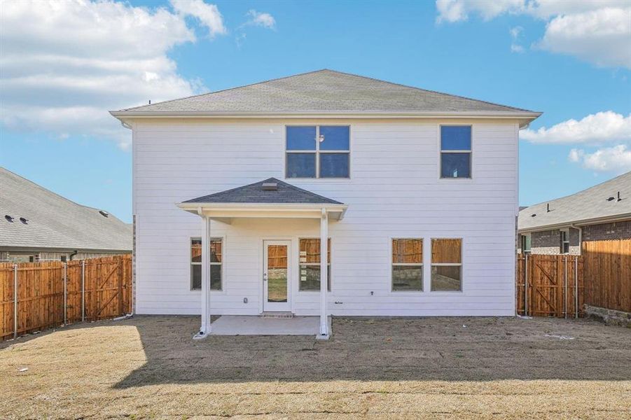 Back of house with a patio, a fenced backyard, and a gate Back of house with a patio, a fenced backyard, and a gate