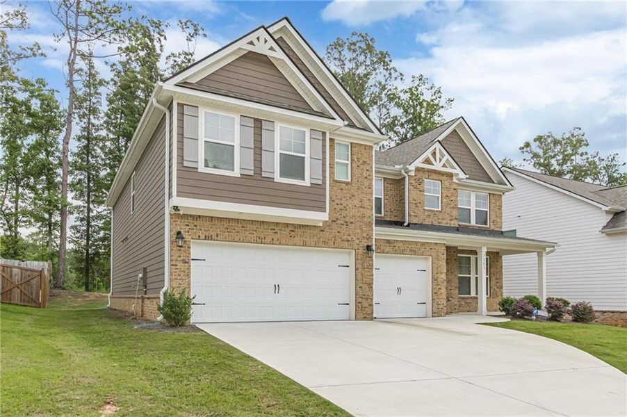 Front exterior of a new home in Twin Shoals, Atlanta, GA, highlighting curb appeal (Image 2). Front exterior of a new home in Twin Shoals, Atlanta, GA, highlighting curb appeal (Image 2).