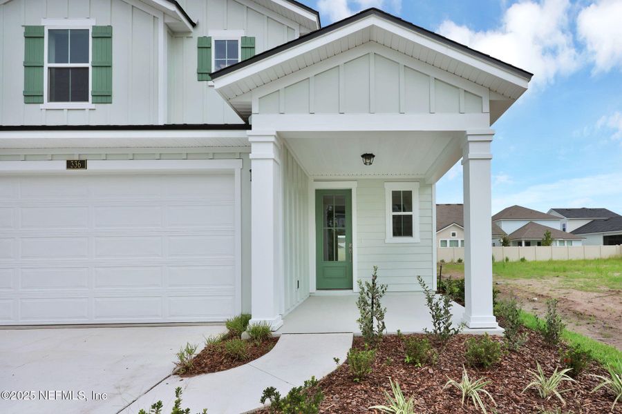 Front exterior of a new home in Seabrook Village at Nocatee, Ponte Vedra, FL, highlighting curb appeal (Image 27).
