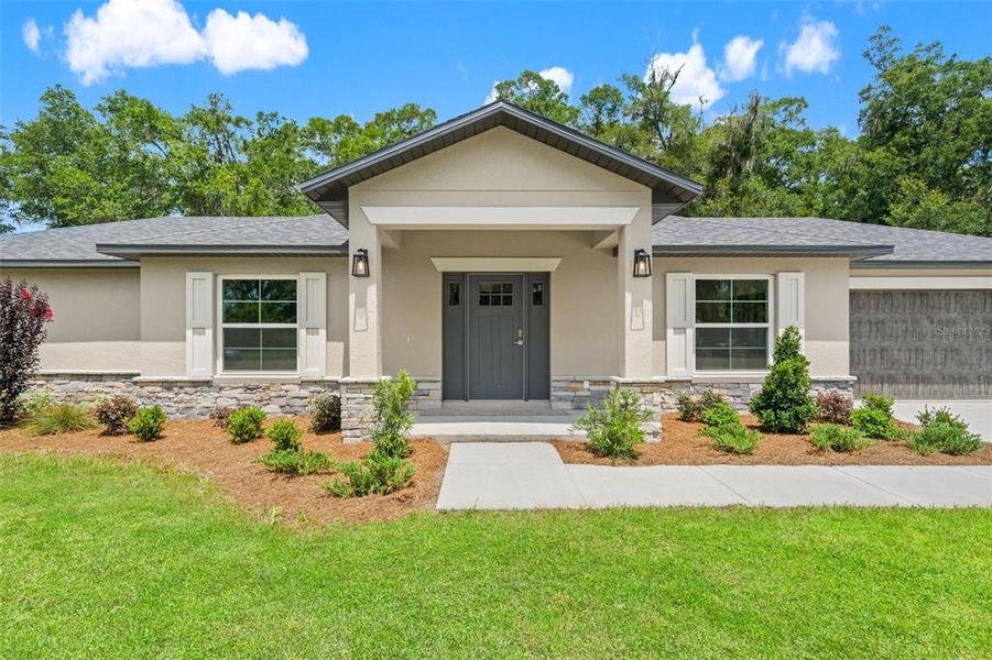 Front exterior of a new home in , Brooksville, FL, highlighting curb appeal (Image 2). Front exterior of a new home in , Brooksville, FL, highlighting curb appeal (Image 2).