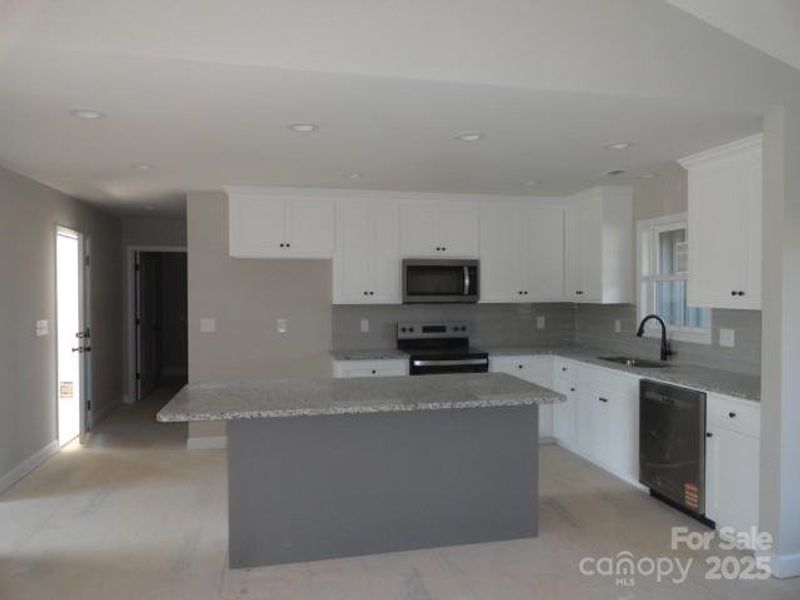 Furnished interior view inside a new home in , Newton (Image 4).