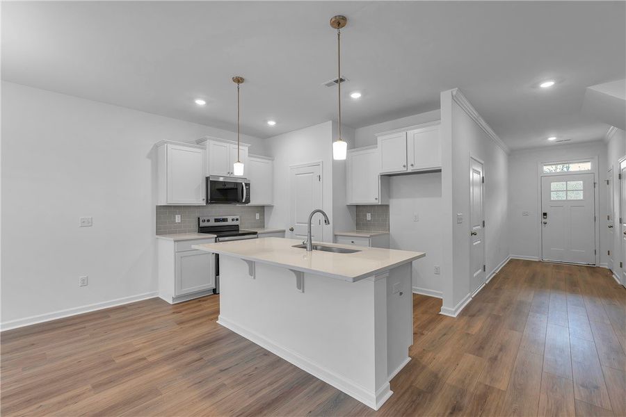 This bright kitchen features a functional island a This bright kitchen features a functional island a