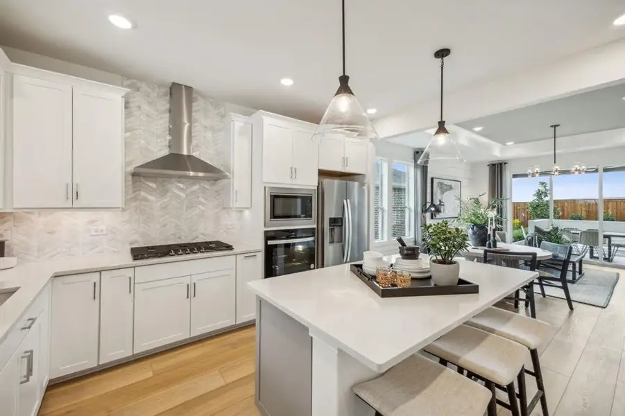 *Model Representation - Spacious kitchen with eat-in bartop island