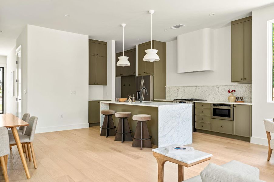 Culinary excellence awaits in this kitchen with a spacious island and high-end appliances.