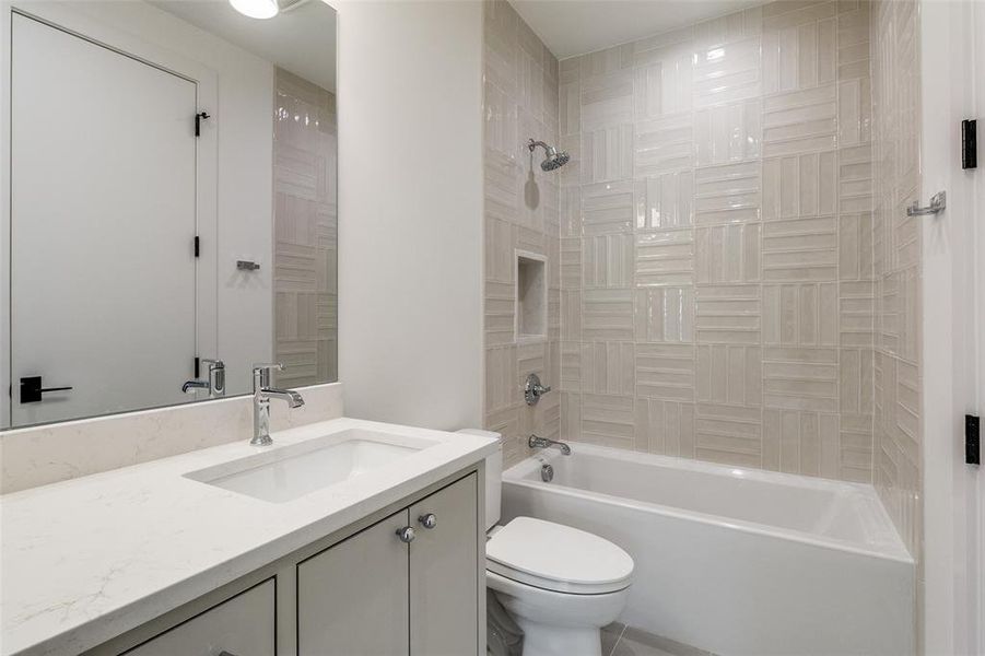 Bathroom featuring shower / bath combination and vanity Bathroom featuring shower / bath combination and vanity