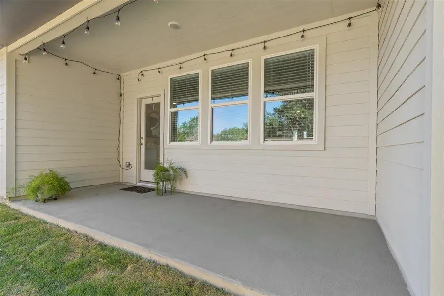 The covered patio is perfect for grilling and lounging.