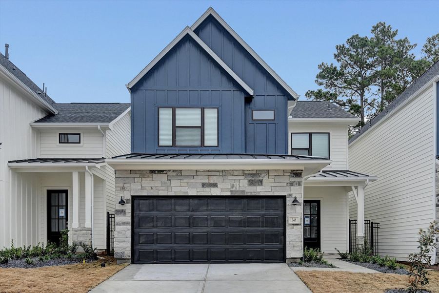 Front exterior of a new home in Summer Place  35', Montgomery, TX, highlighting curb appeal (Image 28).