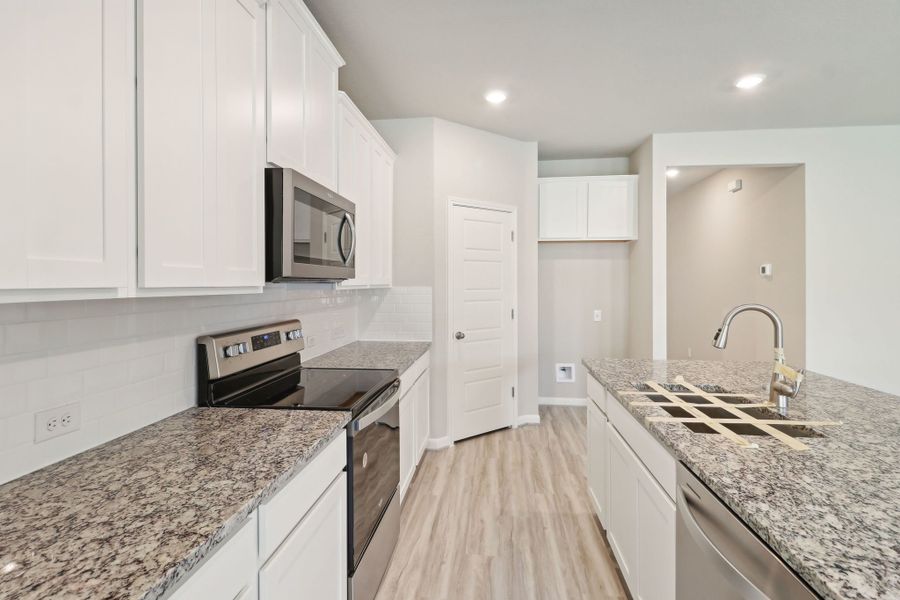 Kitchen in the Callaghan floorplan at a Meritage Homes community.