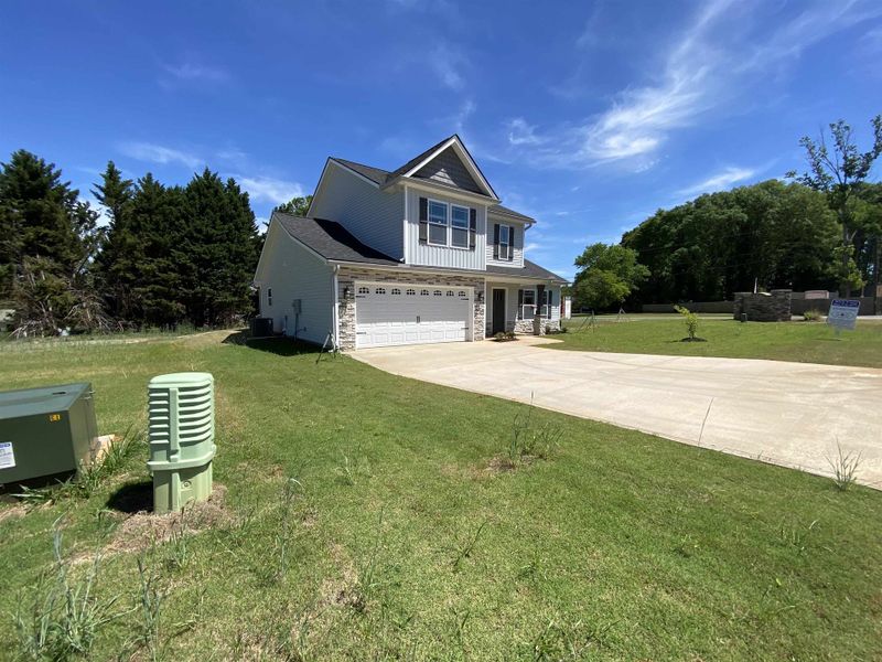 Front exterior of a new home in Ballentine Ridge, Lyman, SC, highlighting curb appeal (Image 19). Front exterior of a new home in Ballentine Ridge, Lyman, SC, highlighting curb appeal (Image 19).