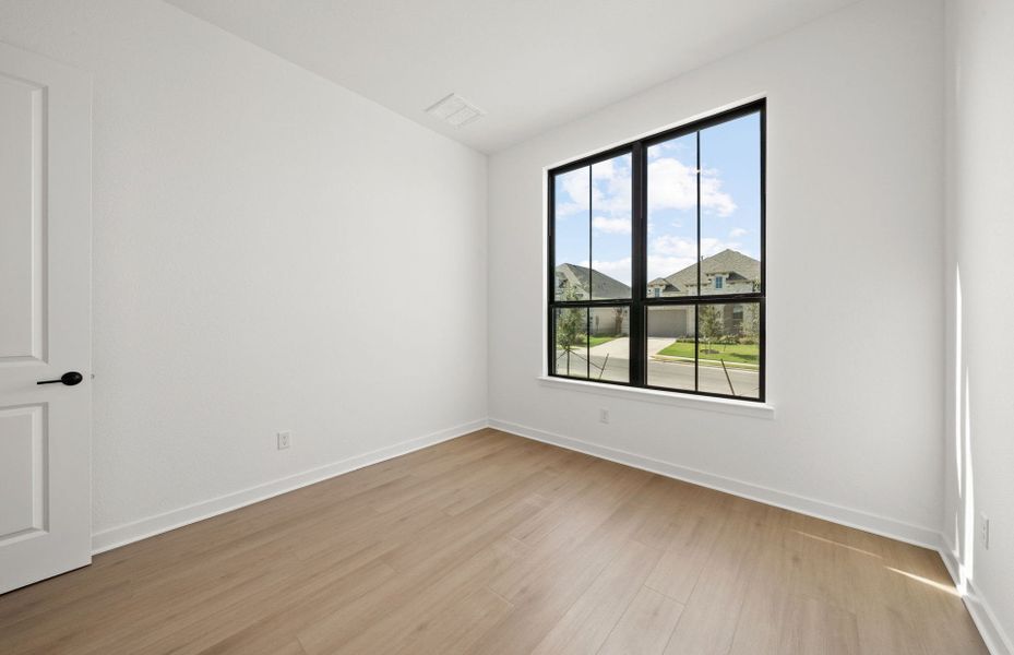 Representative unfurnished interior of a home built from the Dobbin by Pulte Homes in 6 Creeks, Kyle (Image 18).