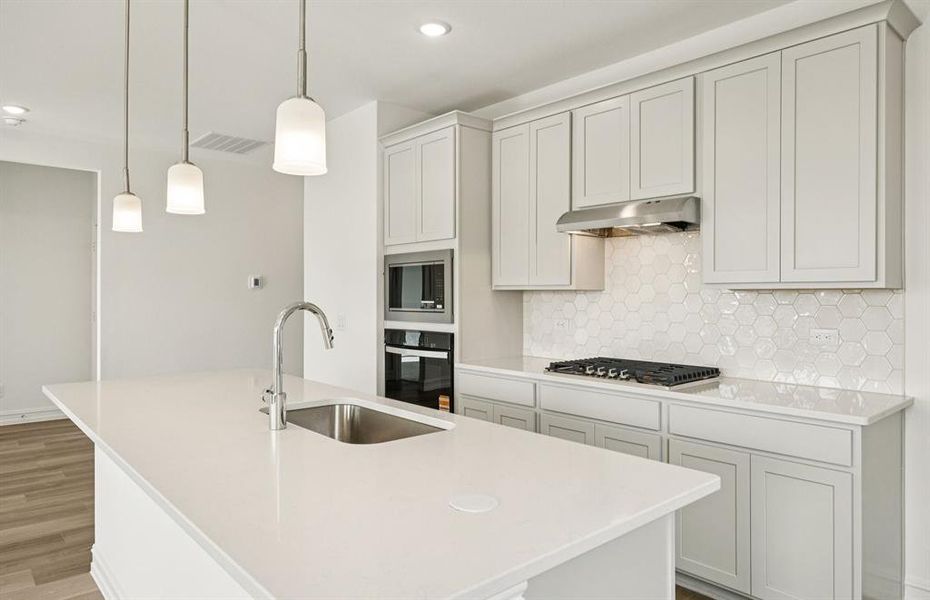 Pendant lighting over island