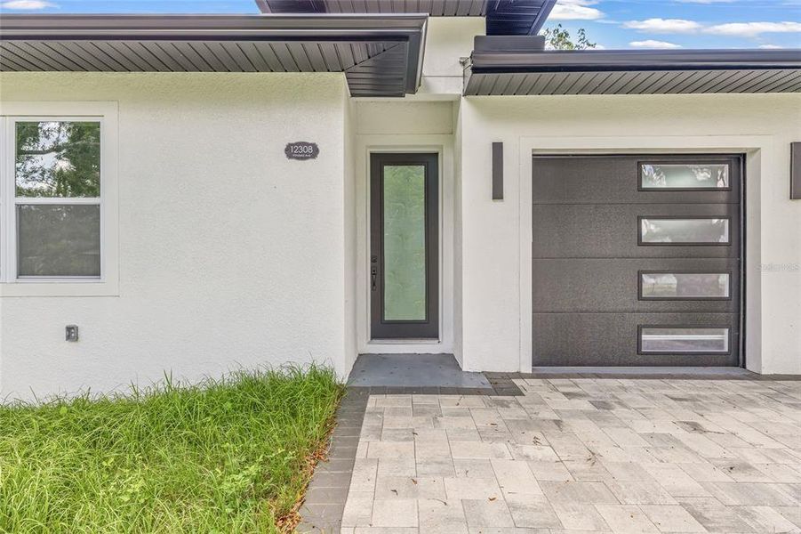 Front exterior of a new home in , Tampa, FL, highlighting curb appeal (Image 1).