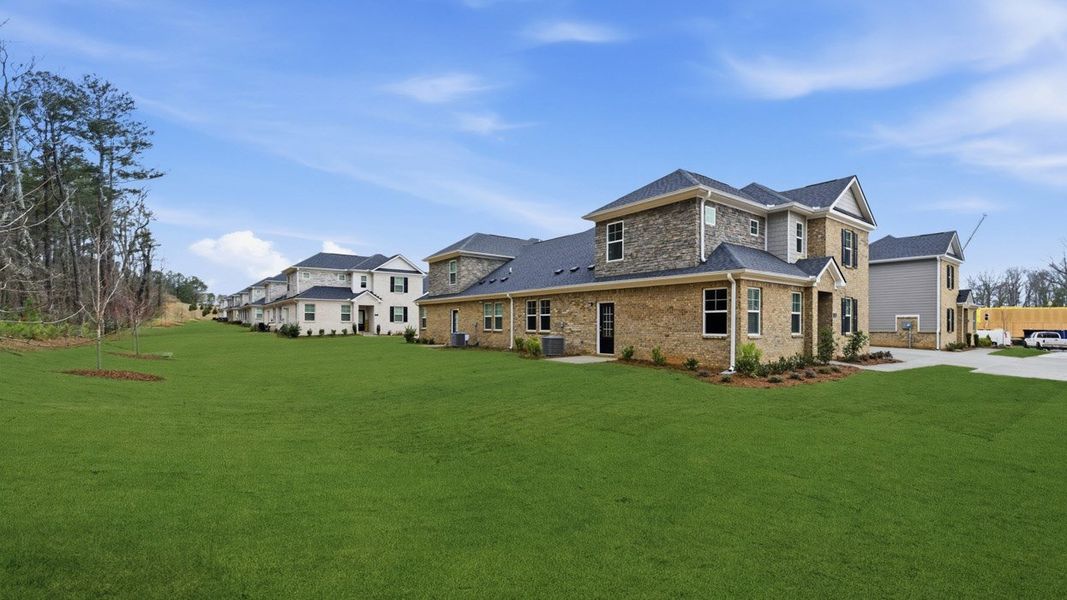 Front exterior of a new home in Independence Villas and Townhomes, Loganville, GA, highlighting curb appeal (Image 2).