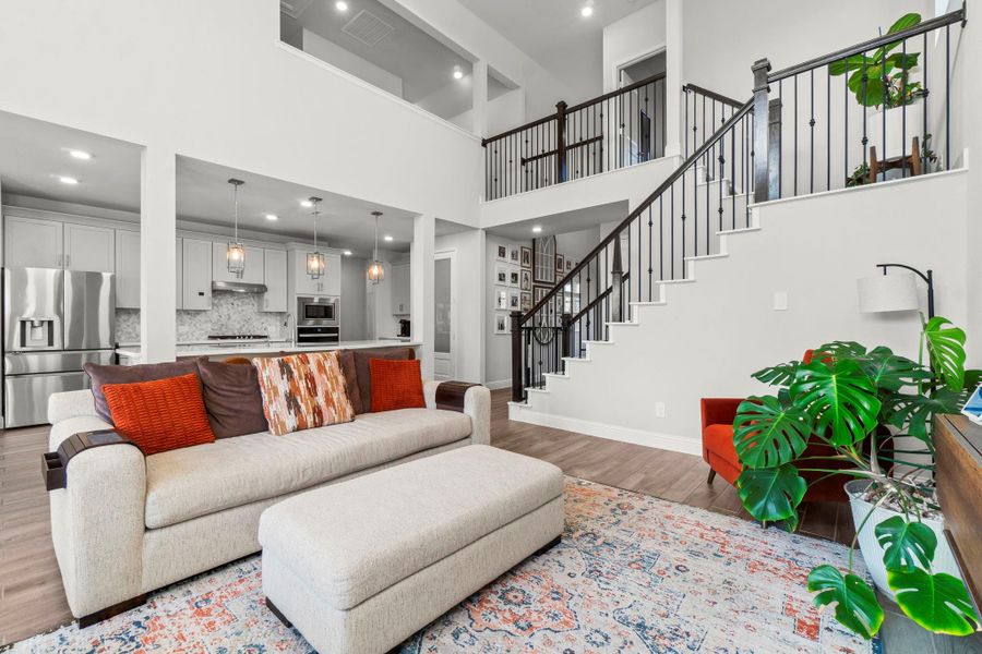 The Kitchen, Living Room, and Breakfast Nook flow seamlessly in this amazing floor plan. Motorized blinds are just another perk of this great room!