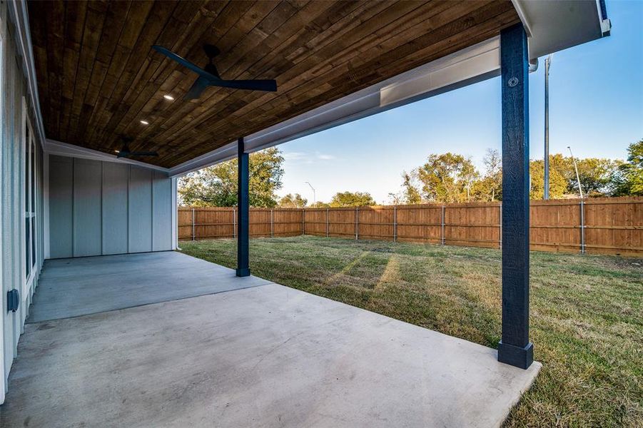 View of patio featuring ceiling fan