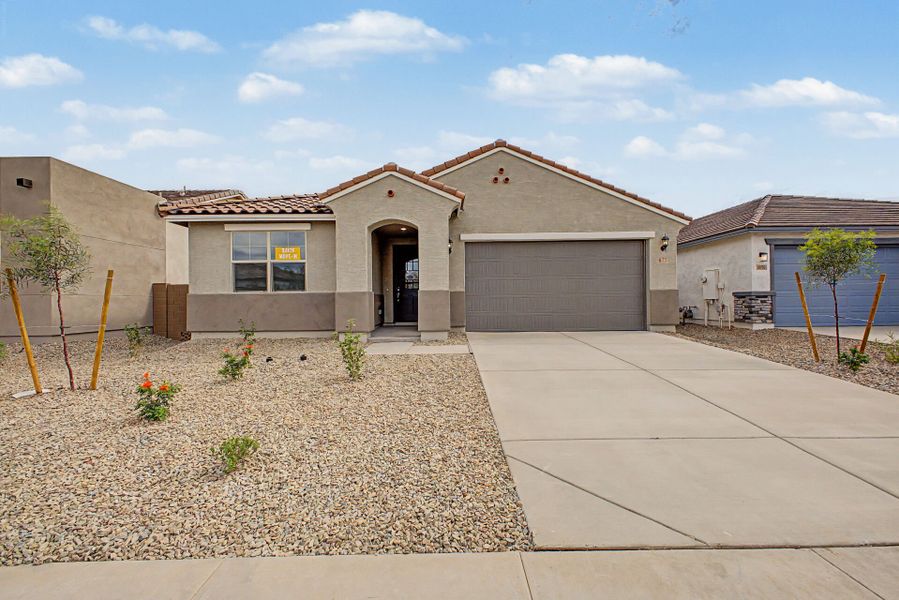 Front exterior of a new home in Landmarke, San Tan Valley, AZ, highlighting curb appeal (Image 1). Front exterior of a new home in Landmarke, San Tan Valley, AZ, highlighting curb appeal (Image 1).