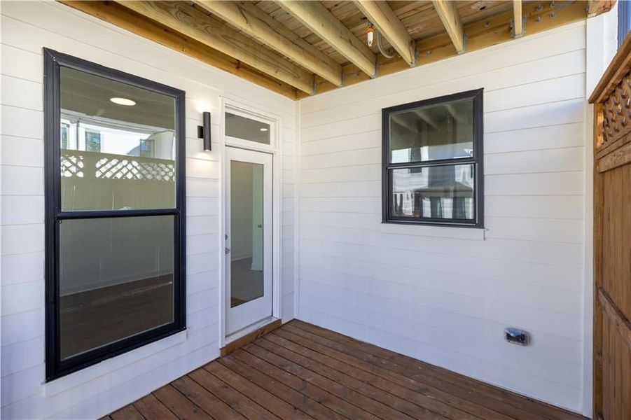 The covered deck offer the sunroom lets you get outside even when its raining.