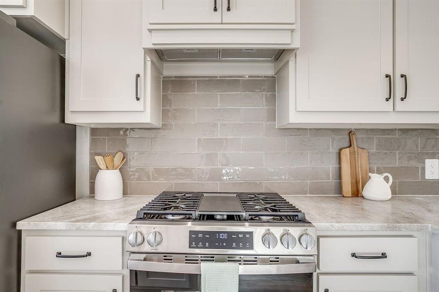 A kitchen that inspires your inner chef with GE stainless steel appliances and gas range. A kitchen that inspires your inner chef with GE stainless steel appliances and gas range.