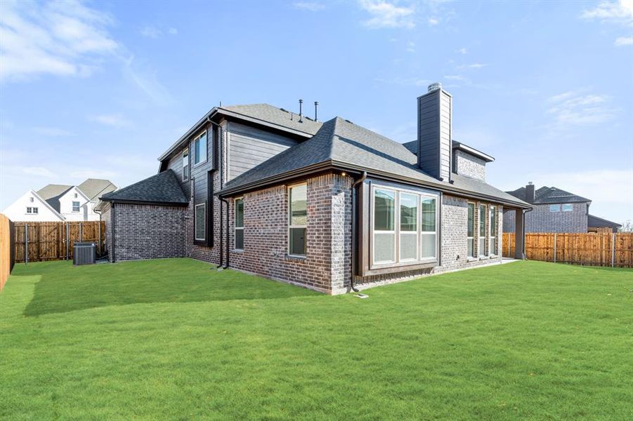 Exterior details and patio area of a home in West Crossing, Anna (Image 28).