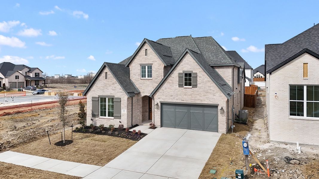 Front exterior of a new home in Hillside Village, Celina, TX, highlighting curb appeal (Image 24). Front exterior of a new home in Hillside Village, Celina, TX, highlighting curb appeal (Image 24).