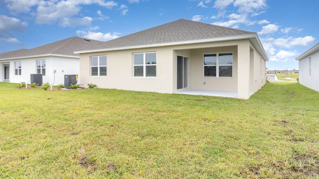 Exterior details and patio area of a home in Cypress Bay West, Palm Bay (Image 18).
