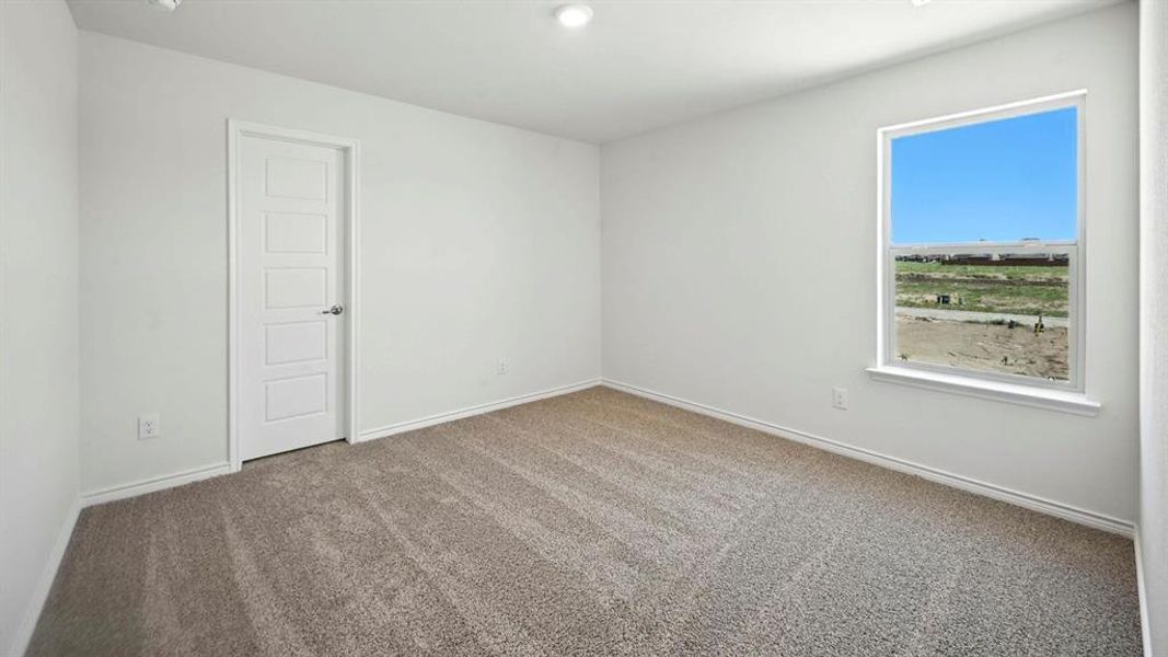 Carpeted spare room with baseboards and recessed lighting Carpeted spare room with baseboards and recessed lighting