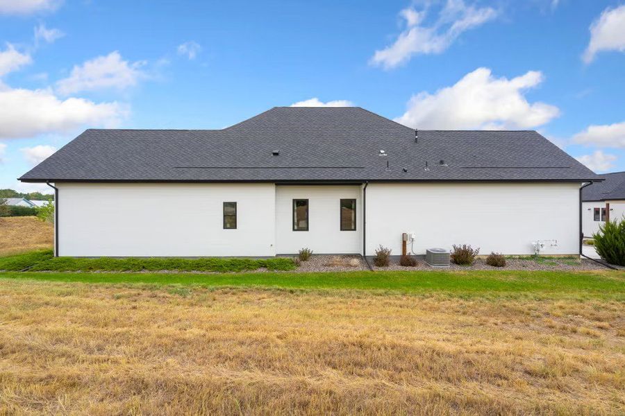 Exterior details and patio area of a home in Pelican Shores at Water Valley, Windsor (Image 3). Exterior details and patio area of a home in Pelican Shores at Water Valley, Windsor (Image 3).
