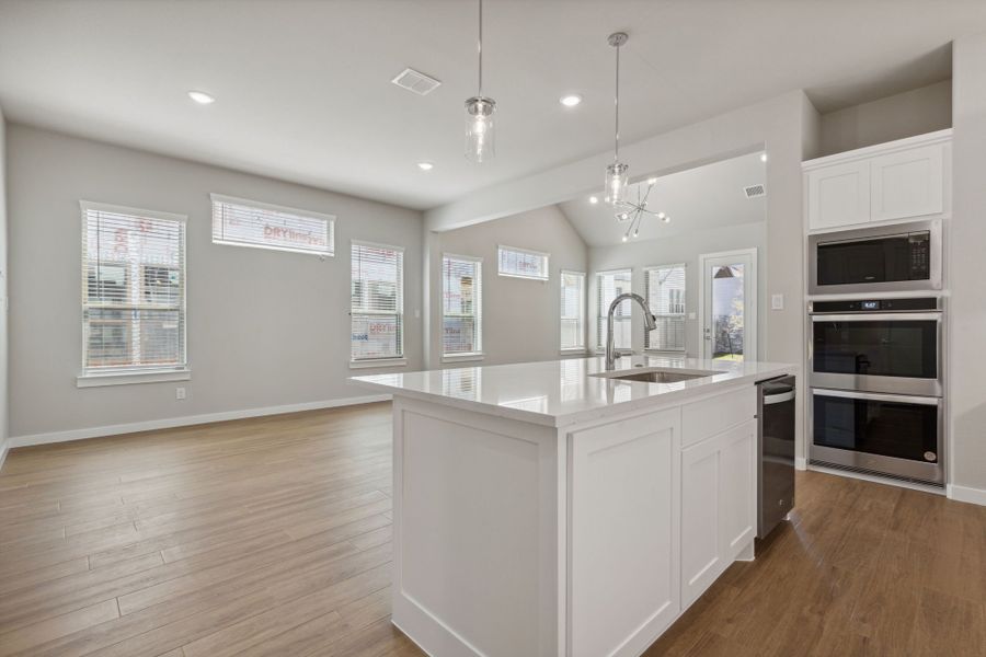 Kitchen in the Picasso II home plan by Trophy Signature Homes – REPRESENTATIVE PHOTO