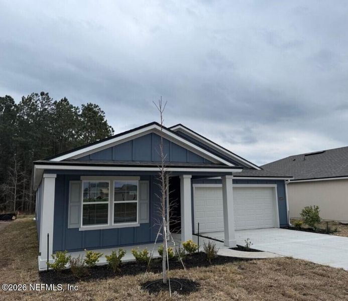 Front exterior of a new home in The Arbors, Jacksonville, FL, highlighting curb appeal (Image 26).