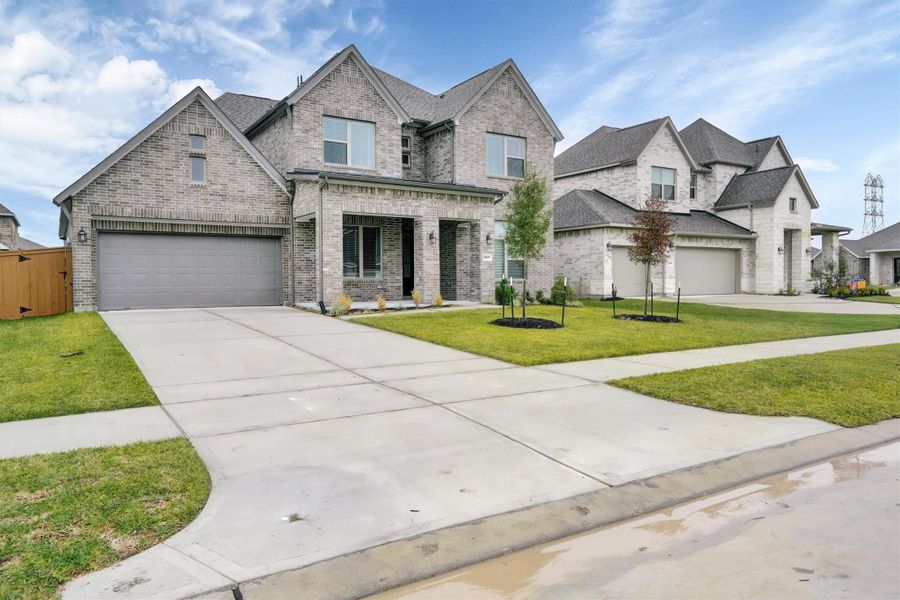 Front exterior of a new home in Canterra Creek  60', Iowa Colony, TX, highlighting curb appeal (Image 25).