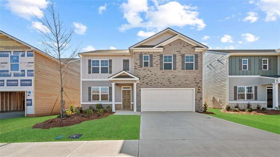 Front exterior of a new home in Poplar Preserve, Newnan, GA, highlighting curb appeal (Image 2).