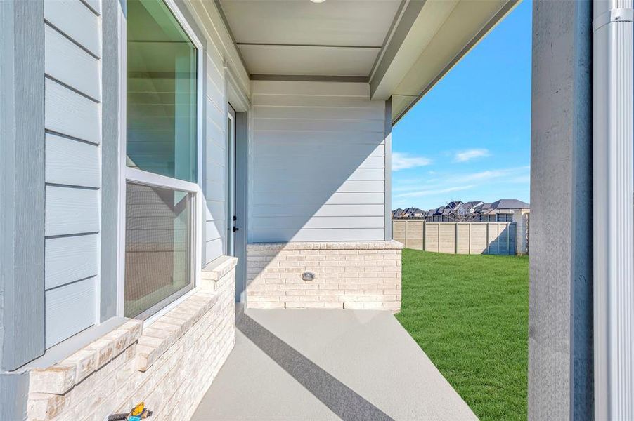 Exterior details and patio area of a home in Treeline, Justin (Image 2).