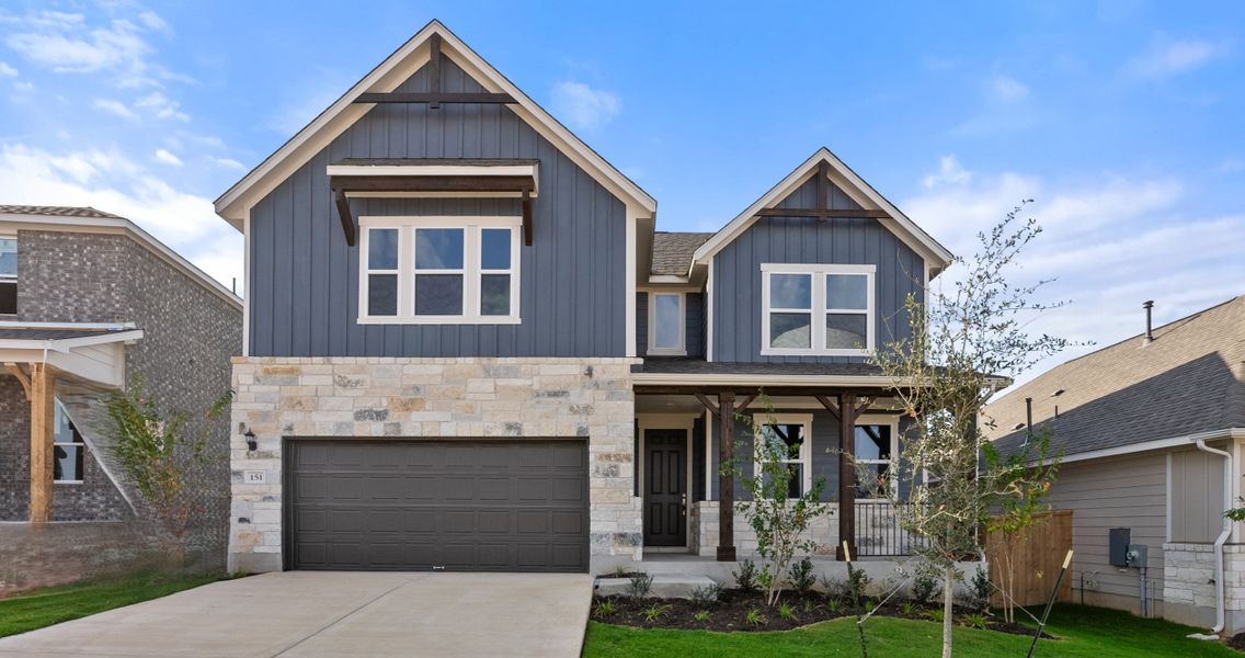 Representative exterior photo of a completed home built from the Somerville by Ashton Woods in Willow Springs, Buda, TX (Image 2).