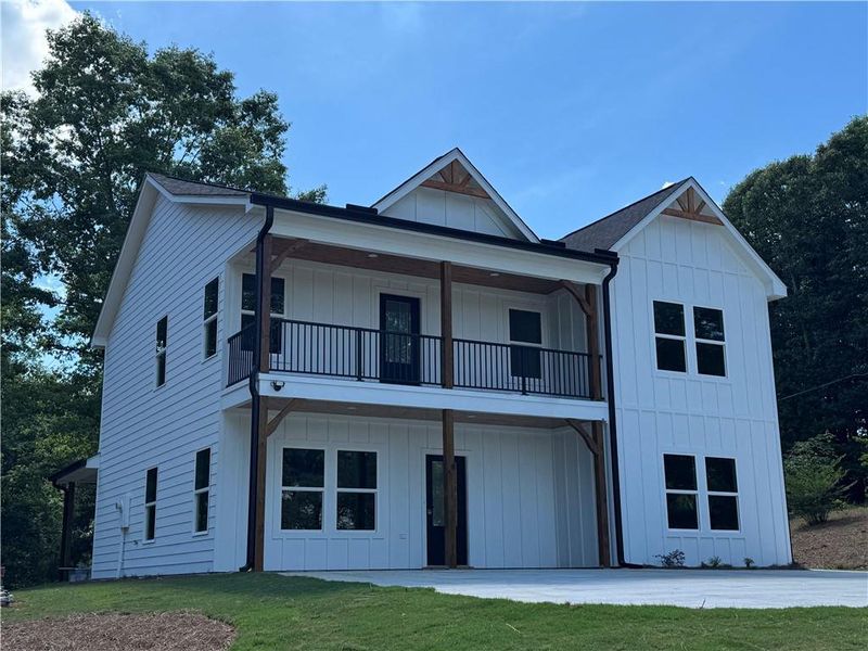 Front exterior of a new home in , Gainesville, GA, highlighting curb appeal (Image 1). Front exterior of a new home in , Gainesville, GA, highlighting curb appeal (Image 1).
