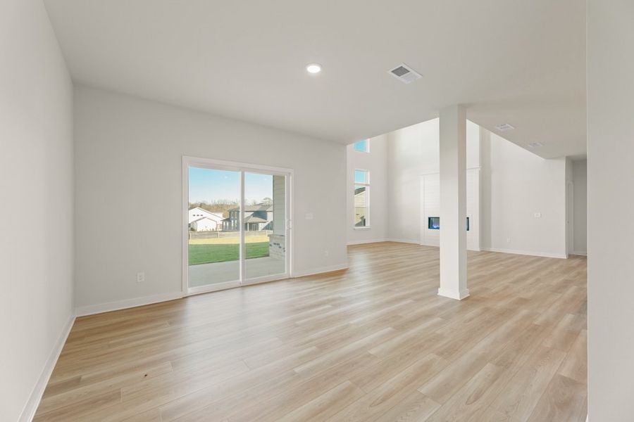A room with a wood floor and a wood floor.