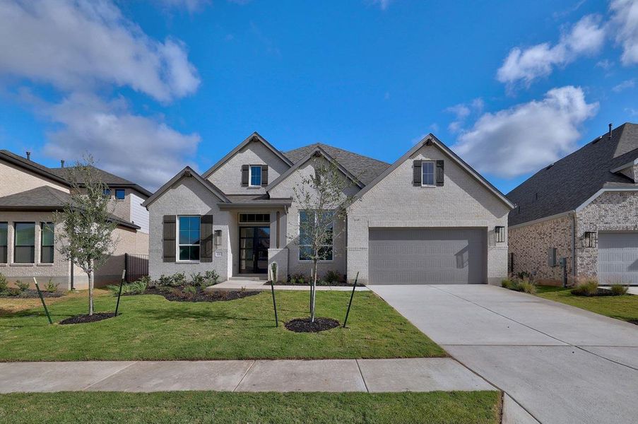 Front exterior of a new home in Santa Rita Ranch, Liberty Hill, TX, highlighting curb appeal (Image 1). Front exterior of a new home in Santa Rita Ranch, Liberty Hill, TX, highlighting curb appeal (Image 1).