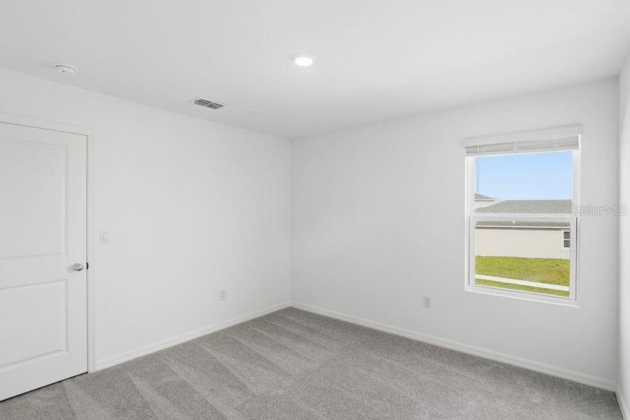 Spacious, unfurnished interior of a new home in Waterstone, Groveland (Image 26).