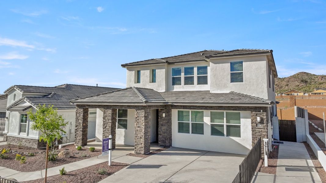 Front exterior of a new home in Aloravita, Peoria, AZ, highlighting curb appeal (Image 2).