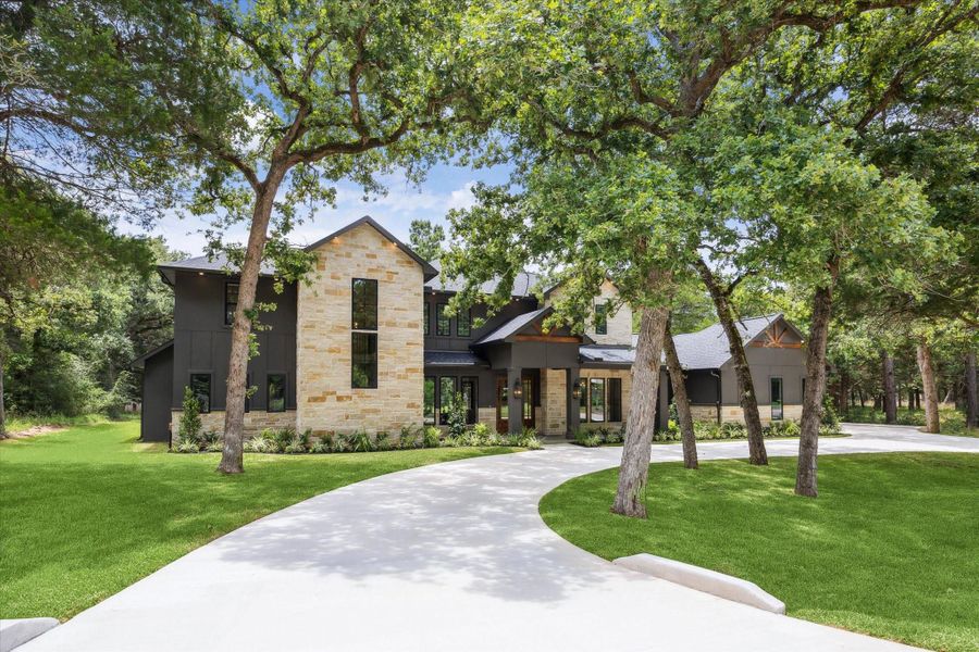 Front exterior of a new home in , New Ulm, TX, highlighting curb appeal (Image 2). Front exterior of a new home in , New Ulm, TX, highlighting curb appeal (Image 2).