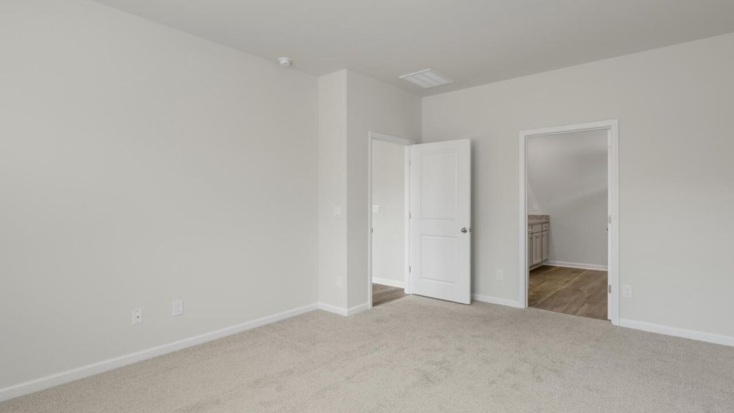 Spacious, unfurnished interior of a new home in Indigo Preserve, Leland (Image 21).