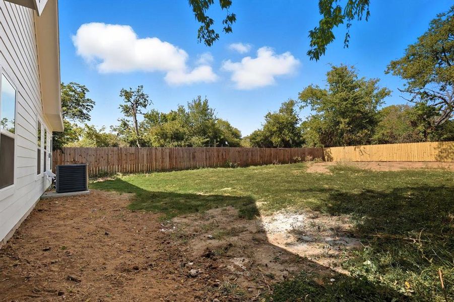 View of fenced backyard