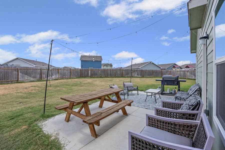 Fenced backyard featuring a patio area and area for grilling Fenced backyard featuring a patio area and area for grilling