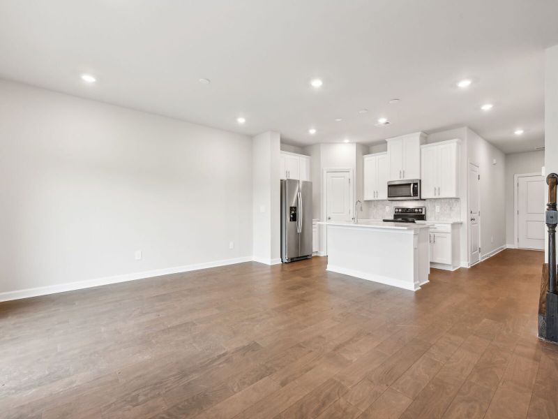 A dining table fits perfectly at the heart of the open-concept living.