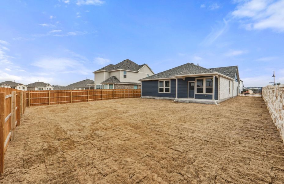 Exterior details and patio area of a home in Saddleback at Santa Rita Ranch, Liberty Hill (Image 28). Exterior details and patio area of a home in Saddleback at Santa Rita Ranch, Liberty Hill (Image 28).