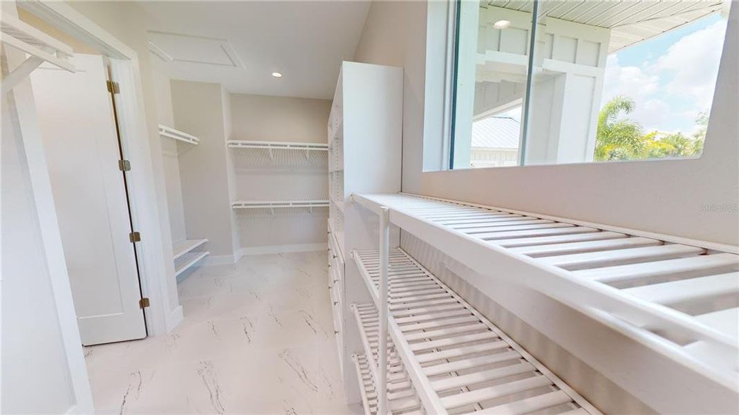 Primary walk-in closet Primary walk-in closet