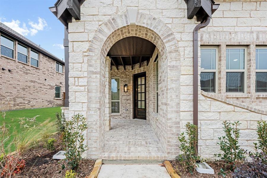 Exterior details and patio area of a home in Windsong Ranch Classic 61, Prosper (Image 4).